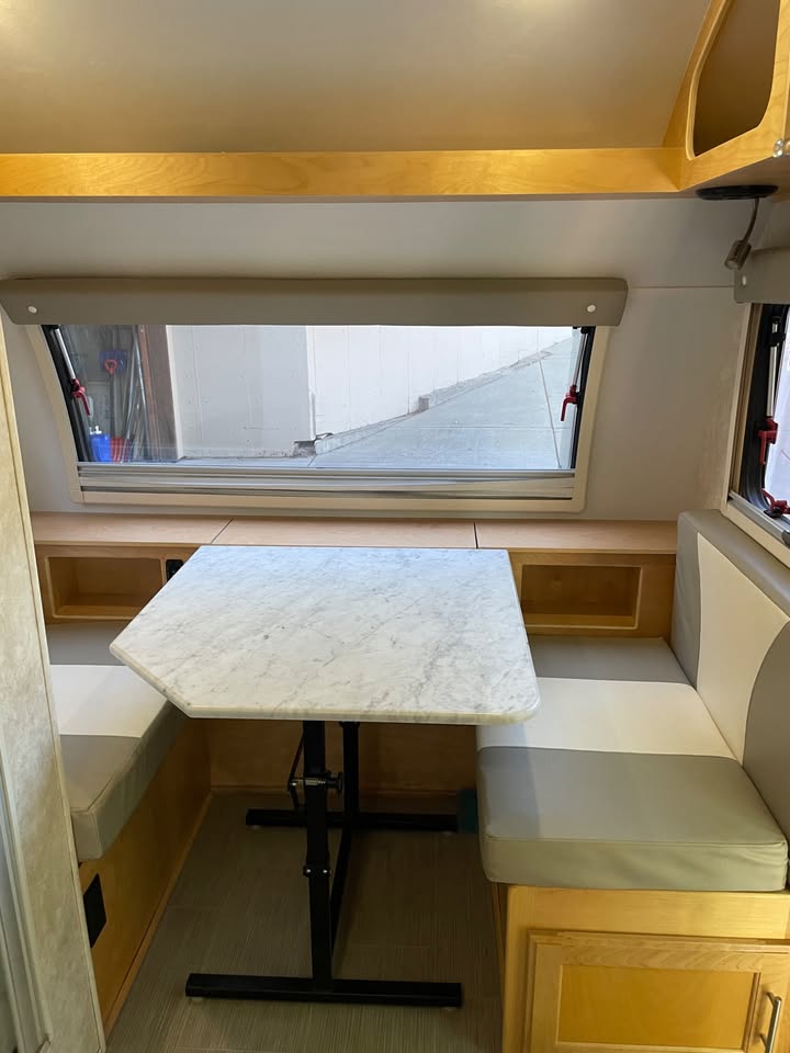 Dinette converted to bed with TV